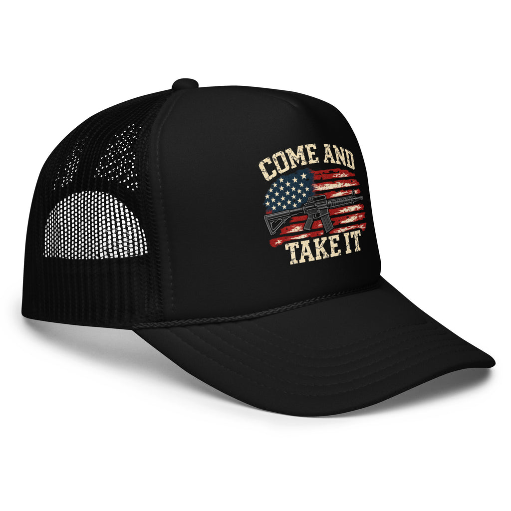 Angled front view of foam trucker hat, black, with Come and Take It lettering, American flag and rifle artwork