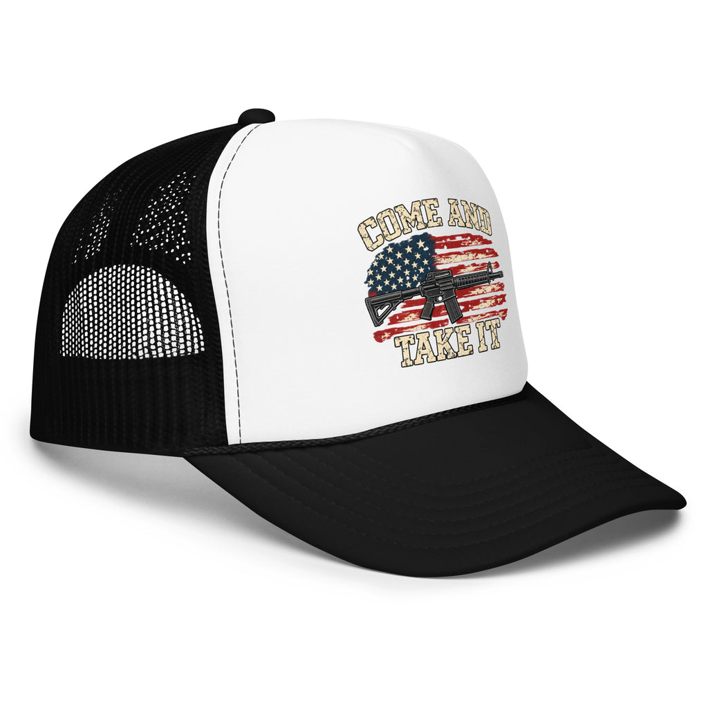Angled front view of foam trucker hat, white with black brim and mesh back, with Come and Take It lettering, American flag and rifle artwork