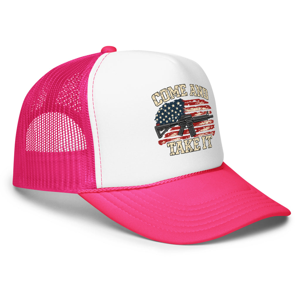 Angled front view of foam trucker hat, white with hot pink brim and mesh back, with Come and Take It lettering, American flag and rifle artwork
