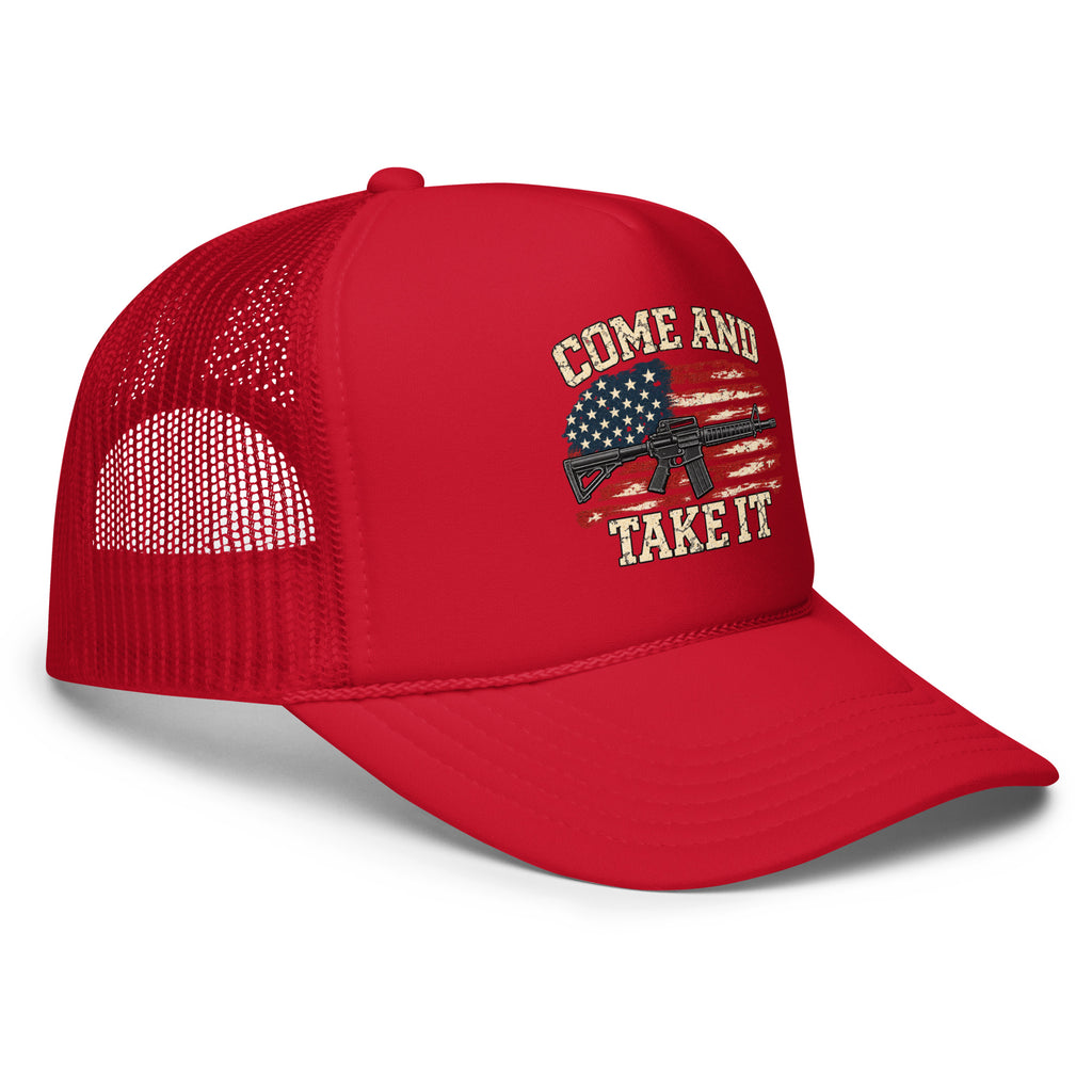 Angled front view of foam trucker hat, red, with Come and Take It lettering, American flag and rifle artwork