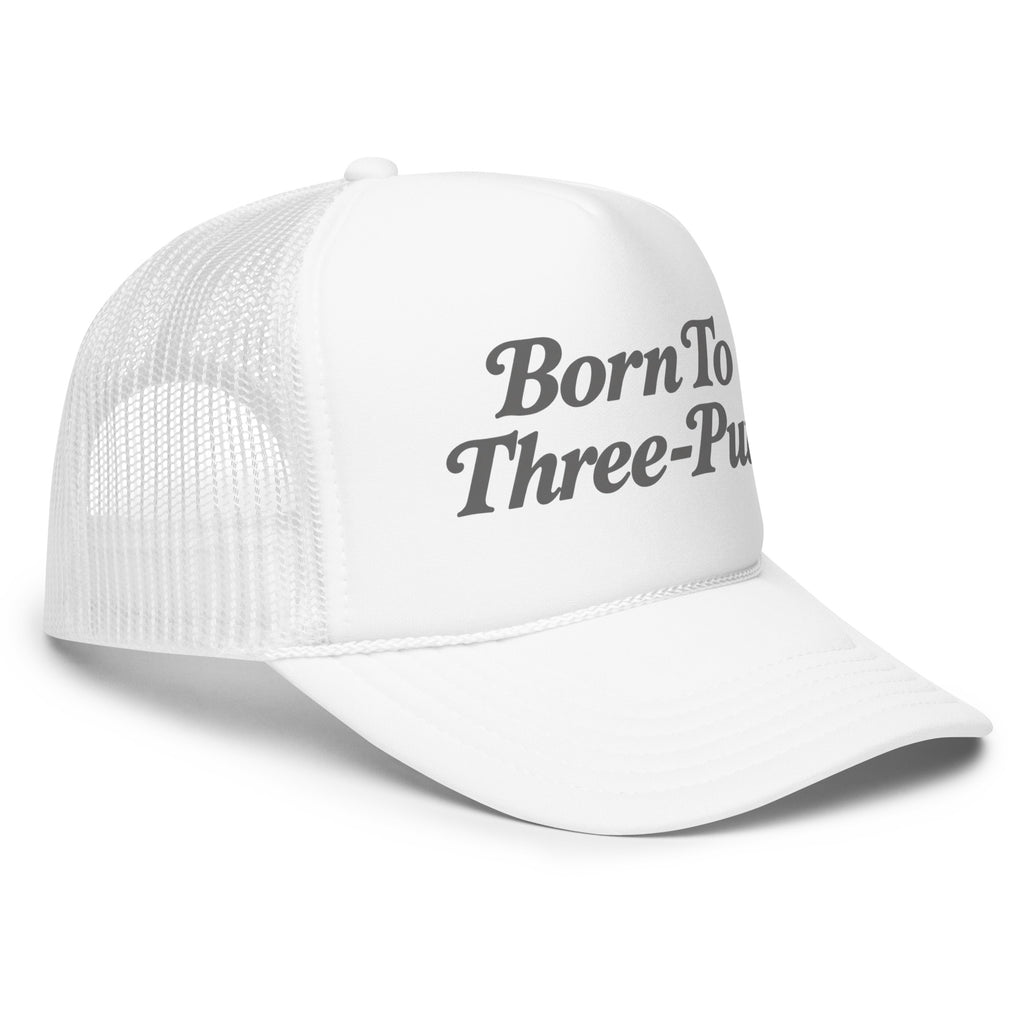 Angled front view of foam trucker hat, white, featuring Born to Three-Putt script lettering