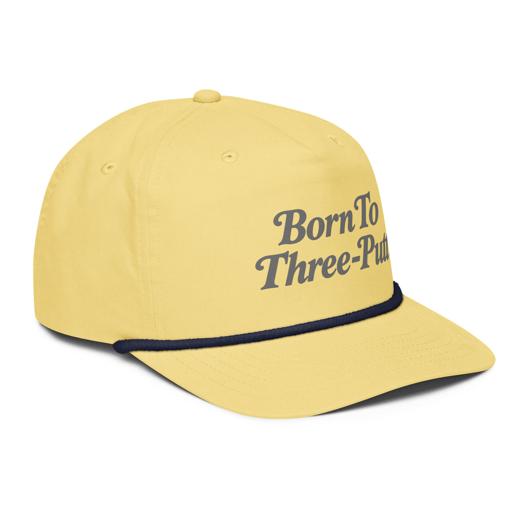 Angled front view of golf rope cap, yellow with navy rope, featuring Born to Three-Putt script lettering