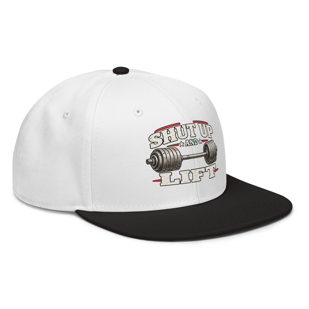 Angled front view of snapback hat, white with black visor, featuring Shut Up and Lift lettering and a barbell graphic