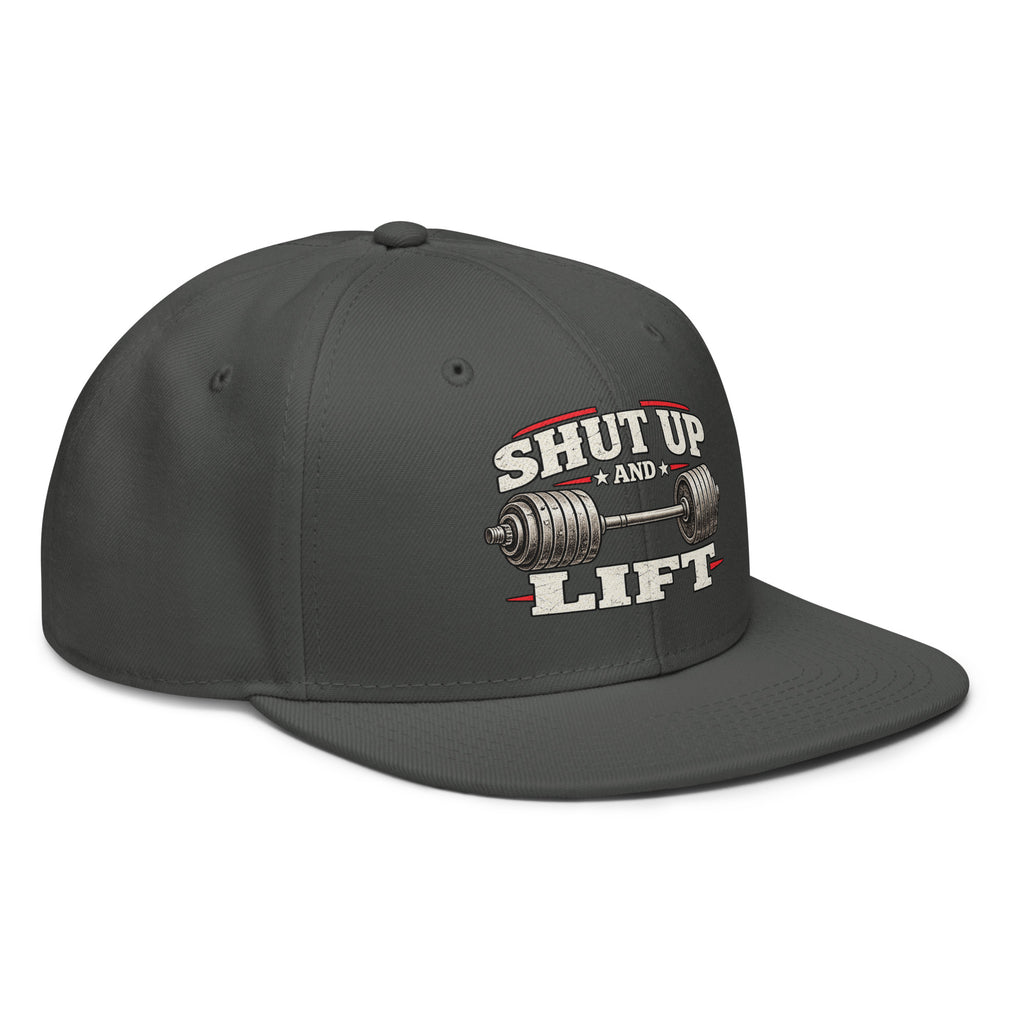 Angled front view of snapback hat, charcoal grey, featuring Shut Up and Lift lettering and a barbell graphic