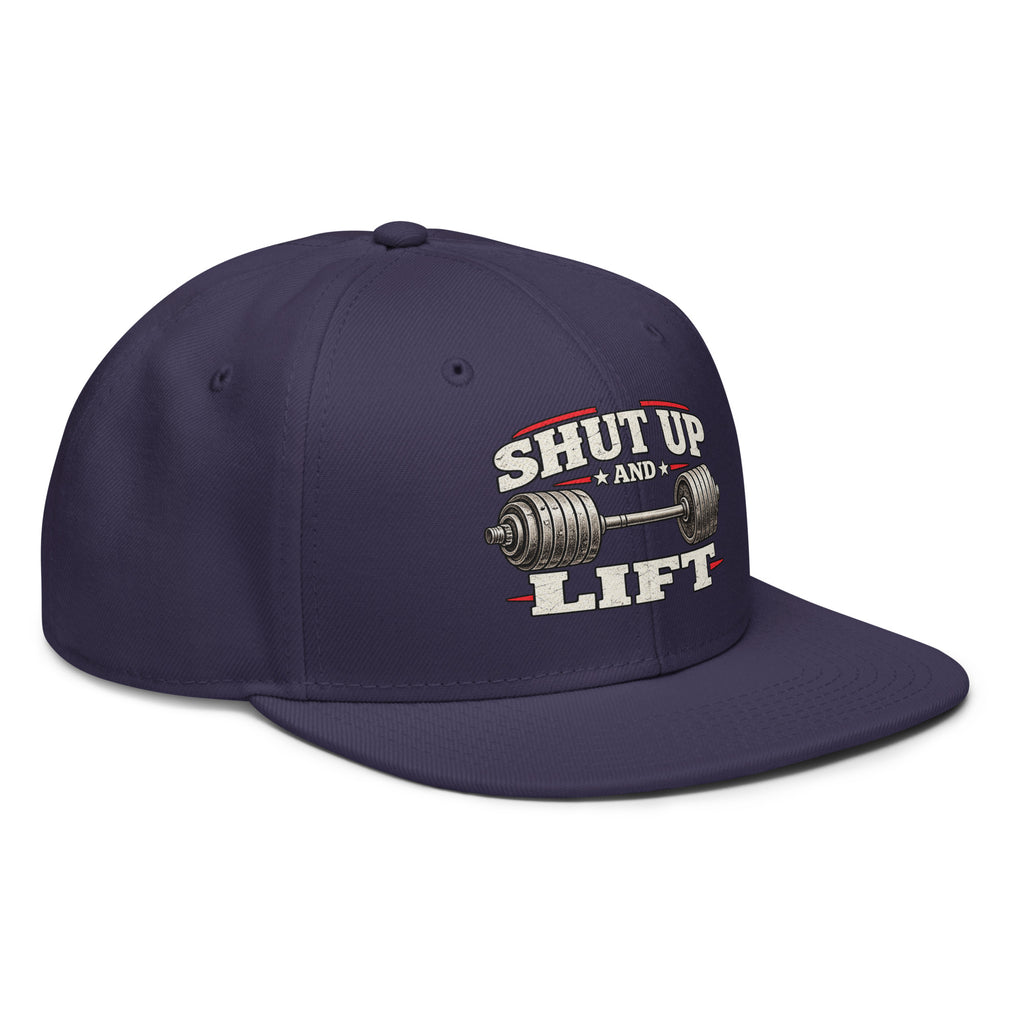 Angled front view of snapback hat, navy blue, featuring Shut Up and Lift lettering and a barbell graphic