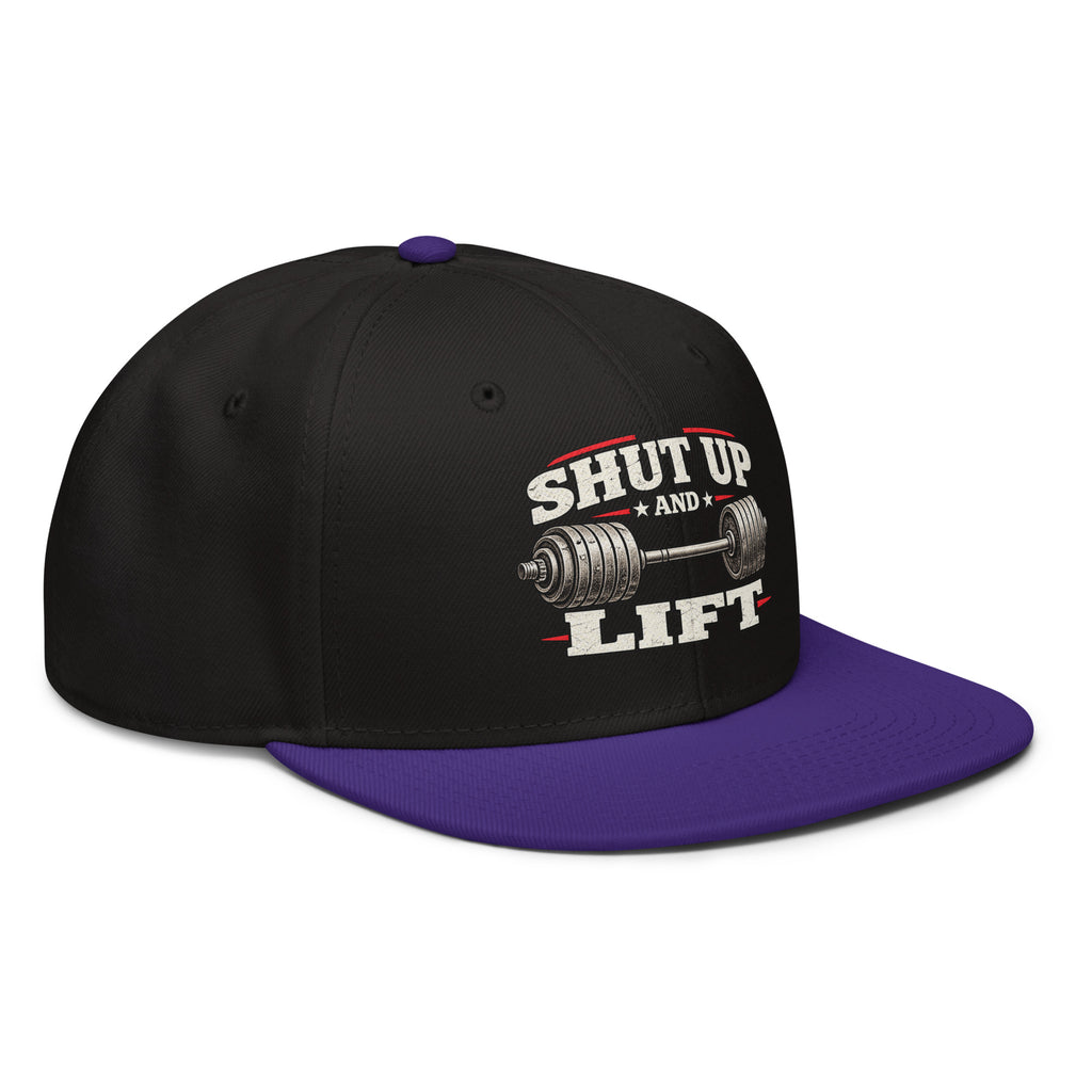 Angled front view of snapback hat, black with purple visor, featuring Shut Up and Lift lettering and a barbell graphic