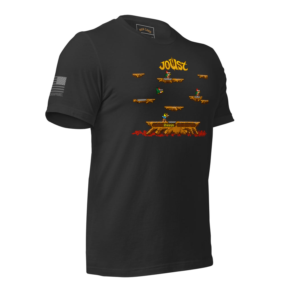Angled front view of dark grey Joust arcade battle T-shirt with pixel-art riders, platforms, and an American flag sleeve detail