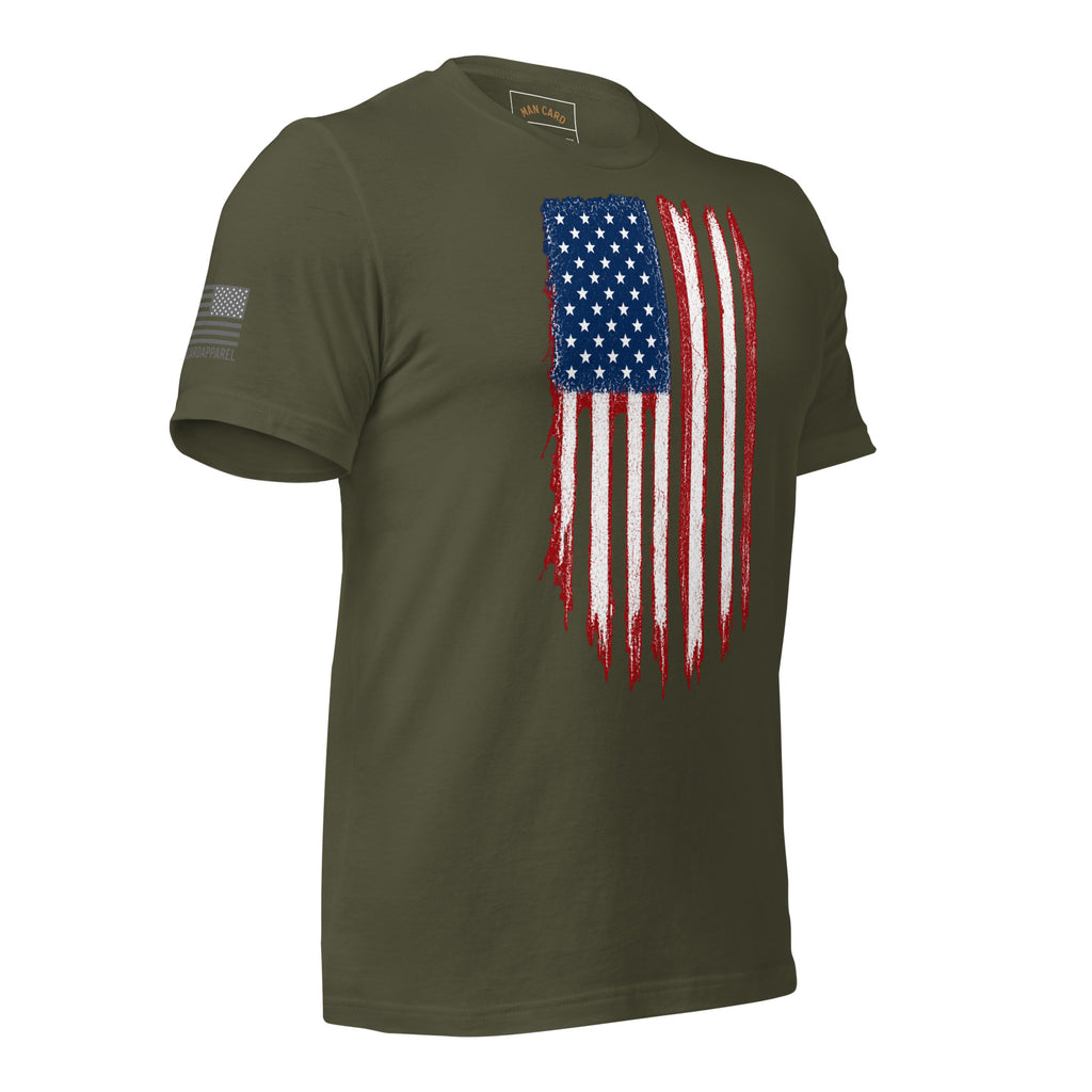 Angled front view of military green T-shirt with a distressed red, white and blue American flag chest graphic and a smaller sleeve flag