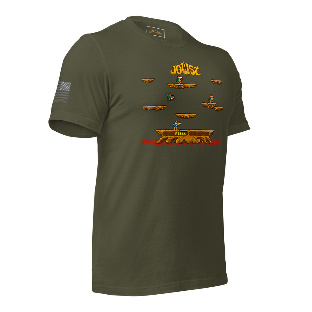Angled front view of military green Joust arcade battle T-shirt with pixel-art riders, platforms, and an American flag sleeve detail