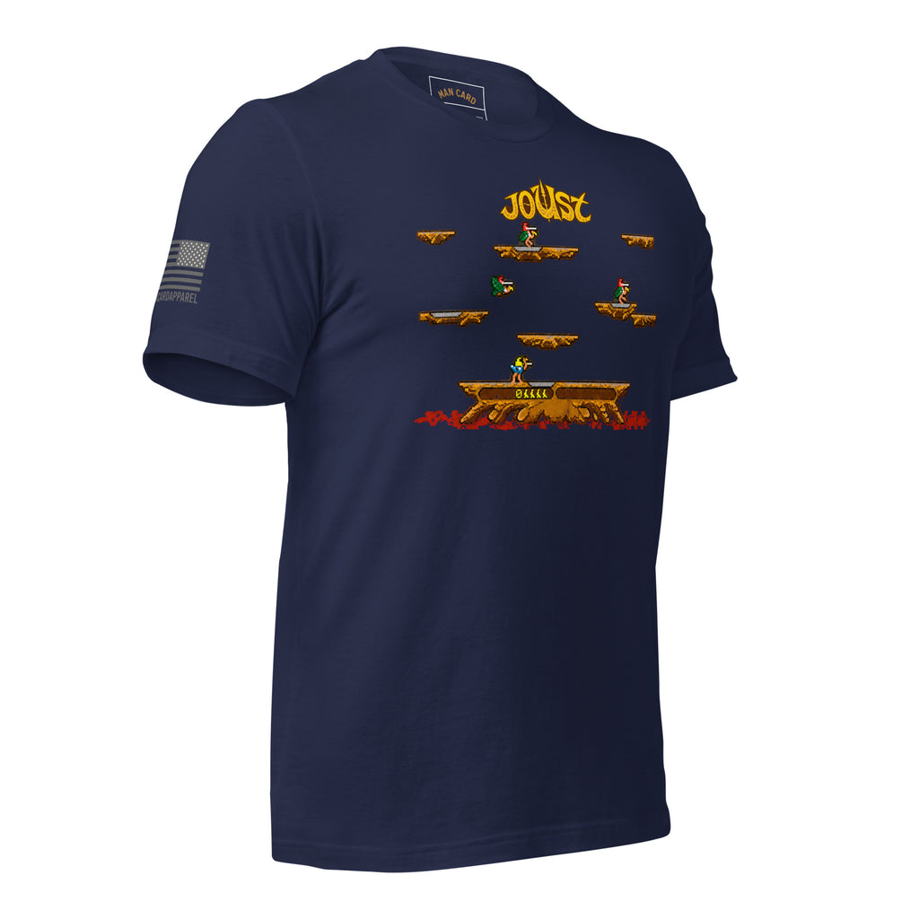 Angled front view of navy Joust arcade battle T-shirt with pixel-art riders, platforms, and an American flag sleeve detail