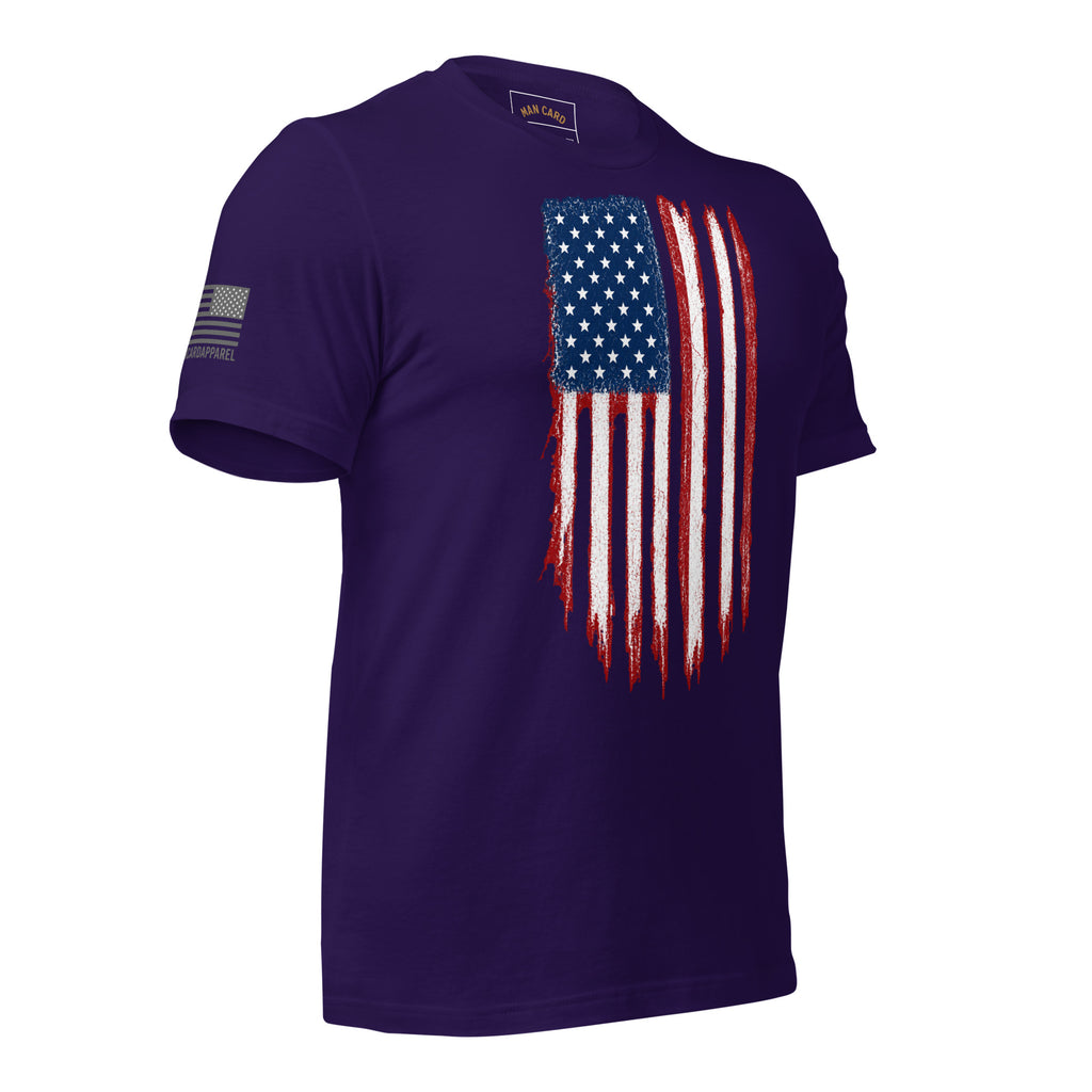 Angled front view of team purple T-shirt with a distressed red, white and blue American flag chest graphic and a smaller sleeve flag